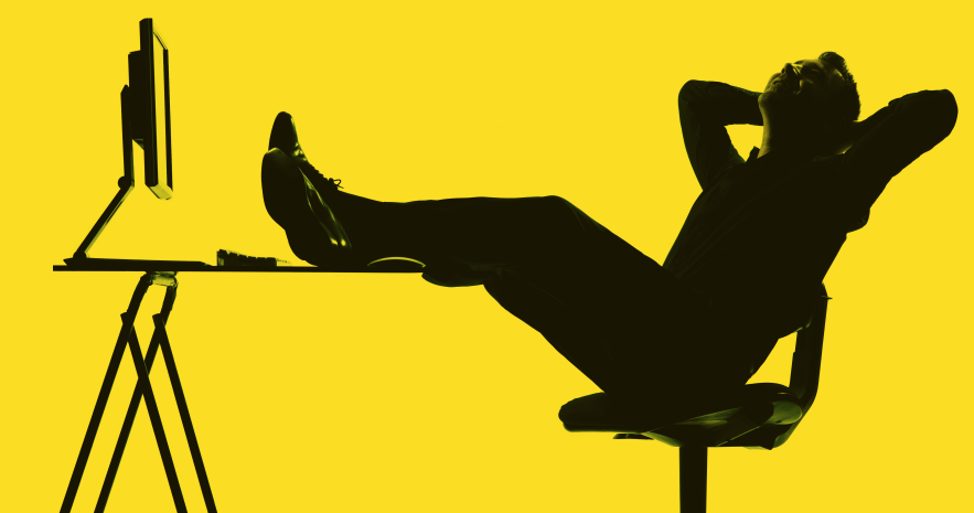image of a buisness man relaxed at his work desk