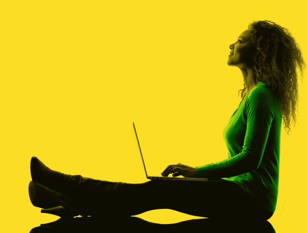 image of a buisness women working on her laptop